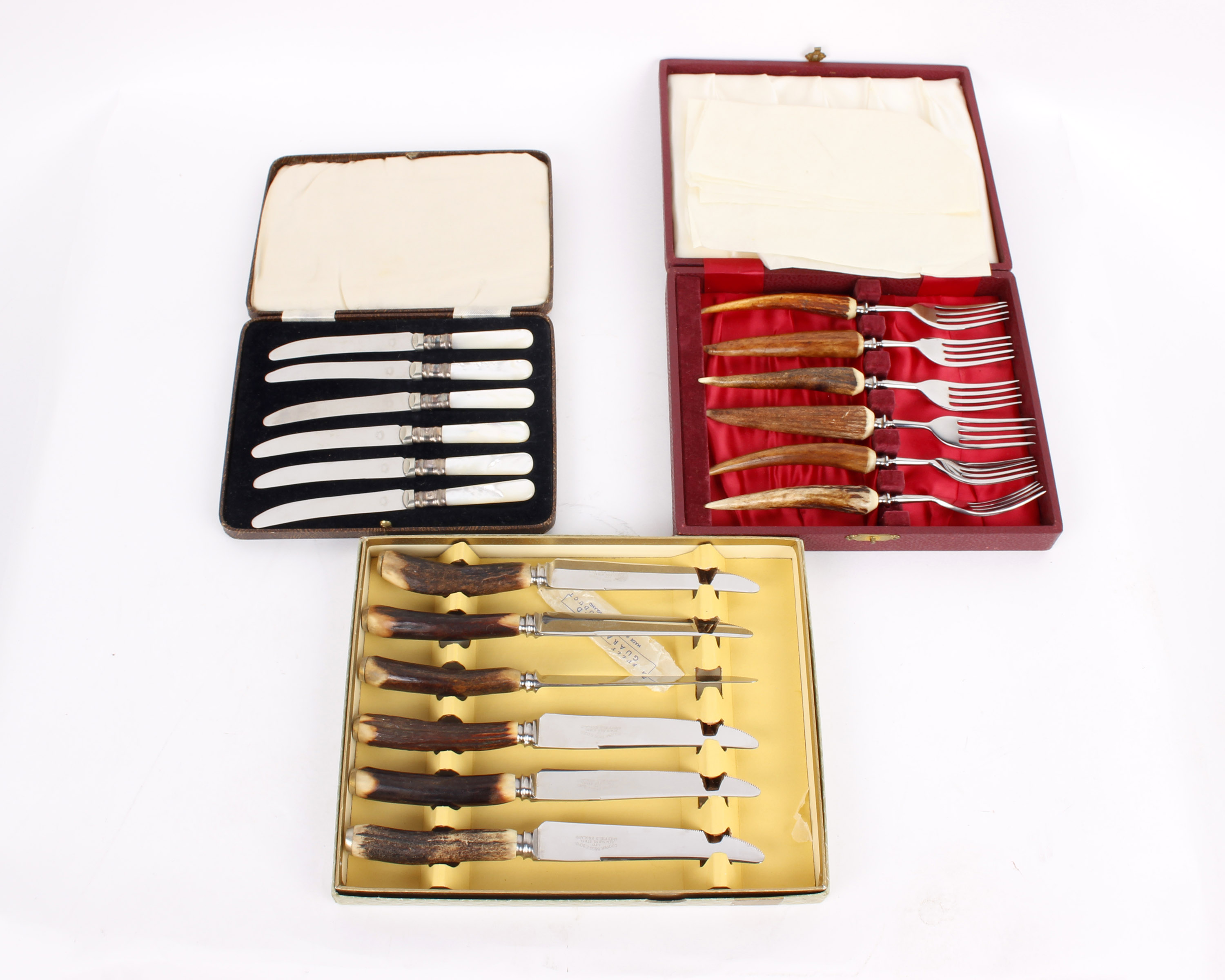 A set of six knives with antler handles by Cooper Bros. & Sons Ltd, Sheffield, together with a set