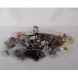 A collection of costume jewellery to include bracelets, necklaces and coins plus other items
