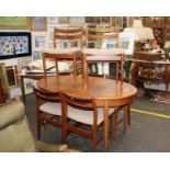 A Mid Century Seven Piece Dining SuiteIncluding six oatmeal fabric chairs and an extension dining