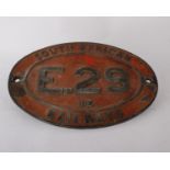 A South African Railways brass cab side number plate E.29 IE. 57.5 by 37cm. Embossed on back 62768