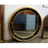 A Regency Style Circular Mirror With Gilt and Ball Surround88 cm diameter; 7cm depth*Please note