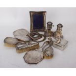 A collection of early 20th century Sterling silver dressing sets to include hand mirrors,