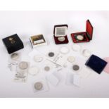 An assortment of Canadian coinage, to include a silver $19, 4 silver Dollars, 6 silver 1oz Maples,