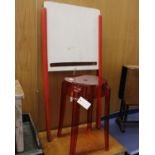 An Orange Kartell Charles Ghost Stool By Philippe Starck and A Child's Two-Sided Easel