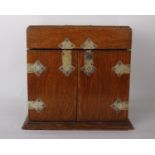 Mahogany desk stationery companion with mirror inside top lid with front open doors and brass