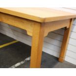 A large heavy handmade oak dining table. Top attached to legs.Dimensions 83cm(W) 109)L) 75cm(H)