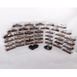 A collection of Atlas Editions silver cars - Chrome plated diecasts displayed in clear cases to