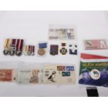 A mixed lot of coins, notes, medals, etc., to include a South Africa 2008 coin / note set, as well