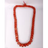 An 18th/19th century large Pink Coral necklace, the graduated beads of cylindrical shape, Largest