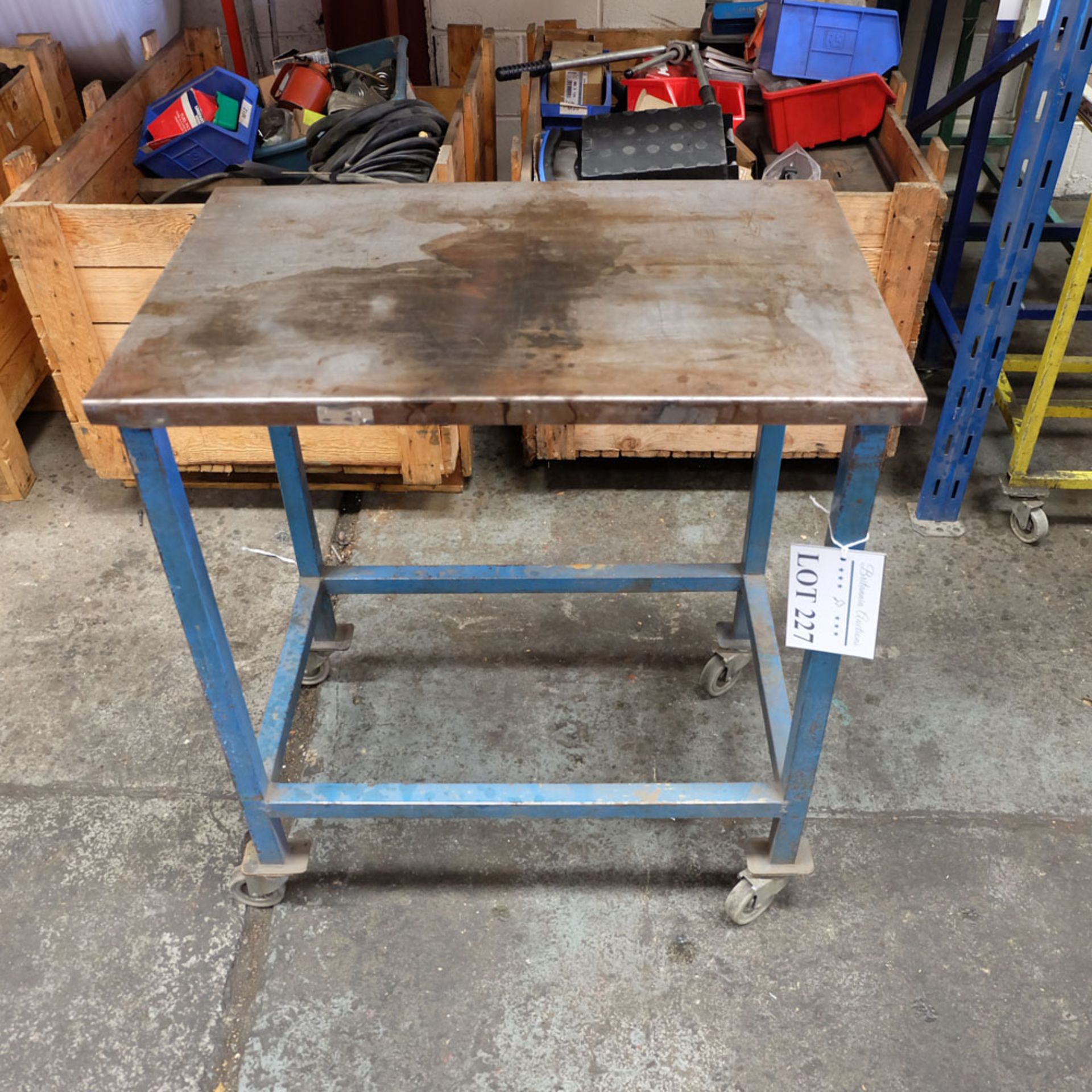 Mobile Steel Table on Castors. Approx Working Height 830mm. Approx Surface Size 740mm x 490mm.