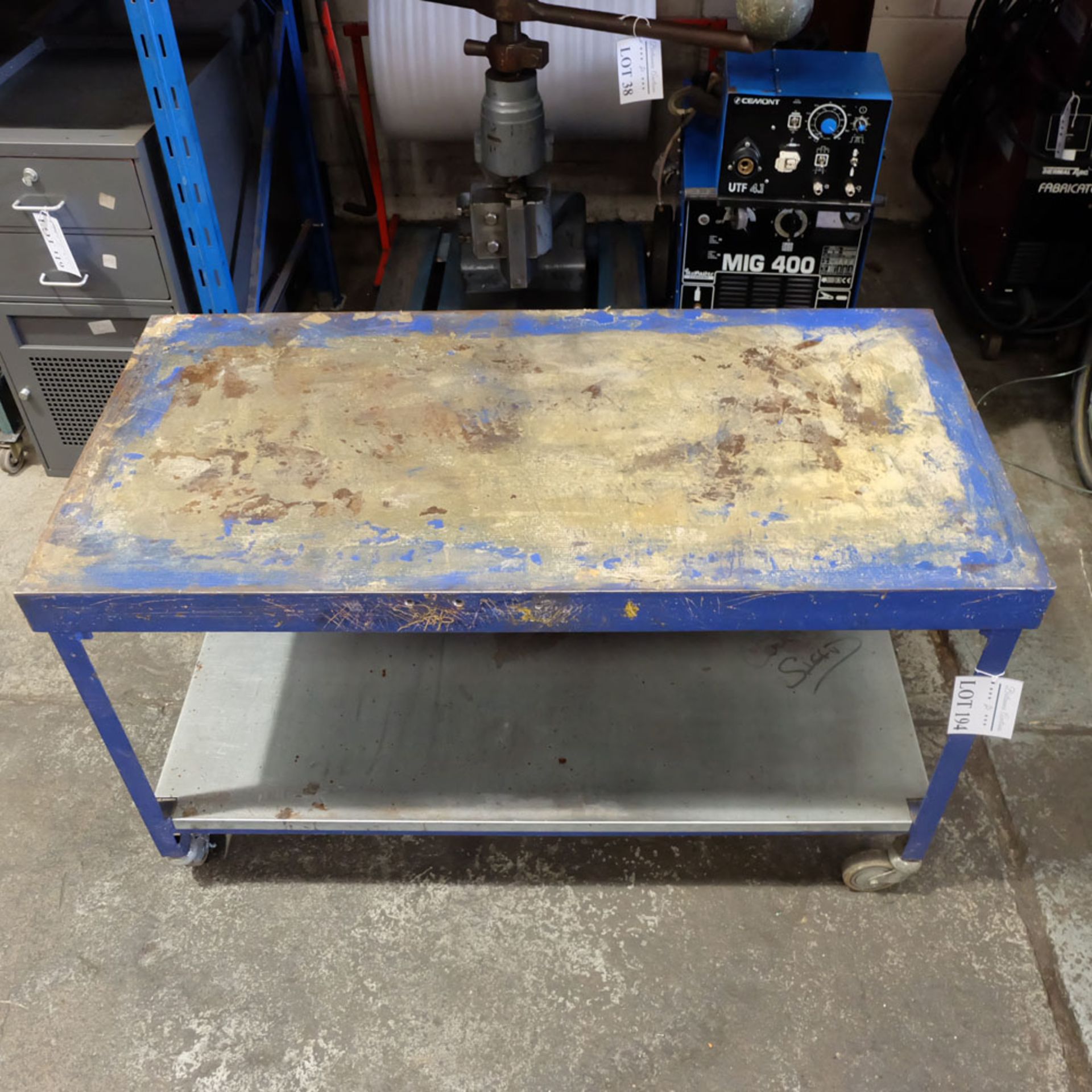 Heavy Duty Steel Table on Castors. Surface Size Approx 54" x 26 3/4".