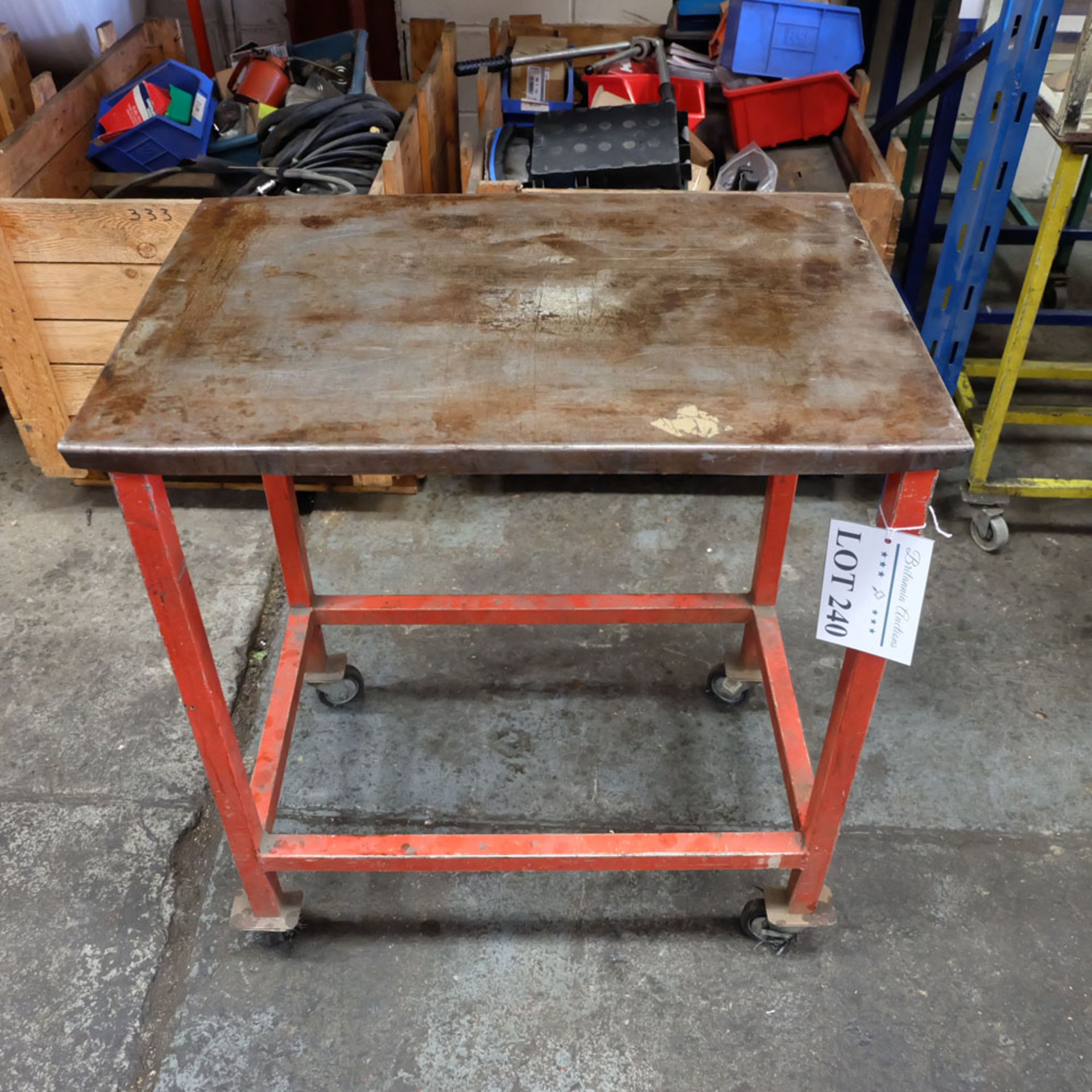 Mobile Steel Table on Castors. Approx Working Height 820mm. Approx Surface Size 740mm x 500mm.