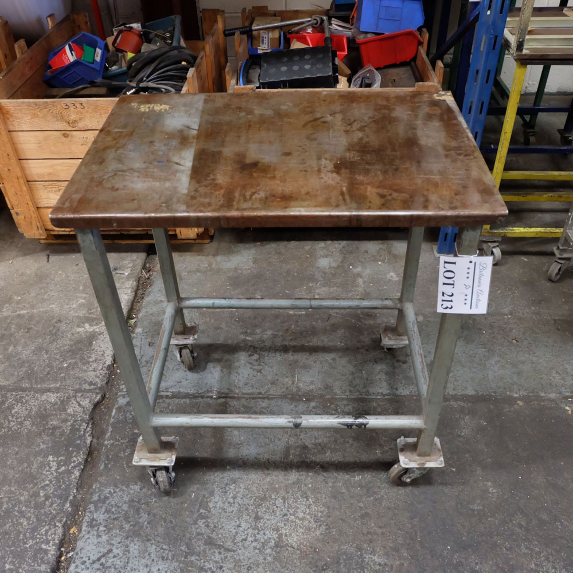 Mobile Steel Table on Castors. Approx Working Height 840mm. Approx Surface Size 750mm x 500mm.
