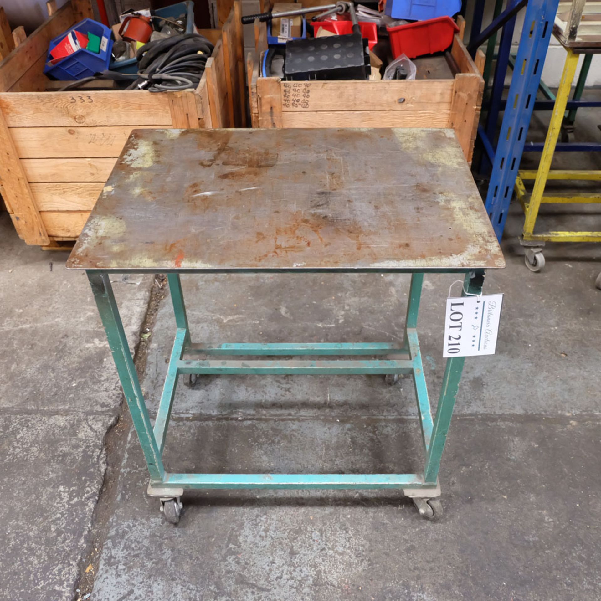 Mobile Steel Table on Castors. Approx Working Height 740mm. Approx Surface Size 680mm x 480mm.