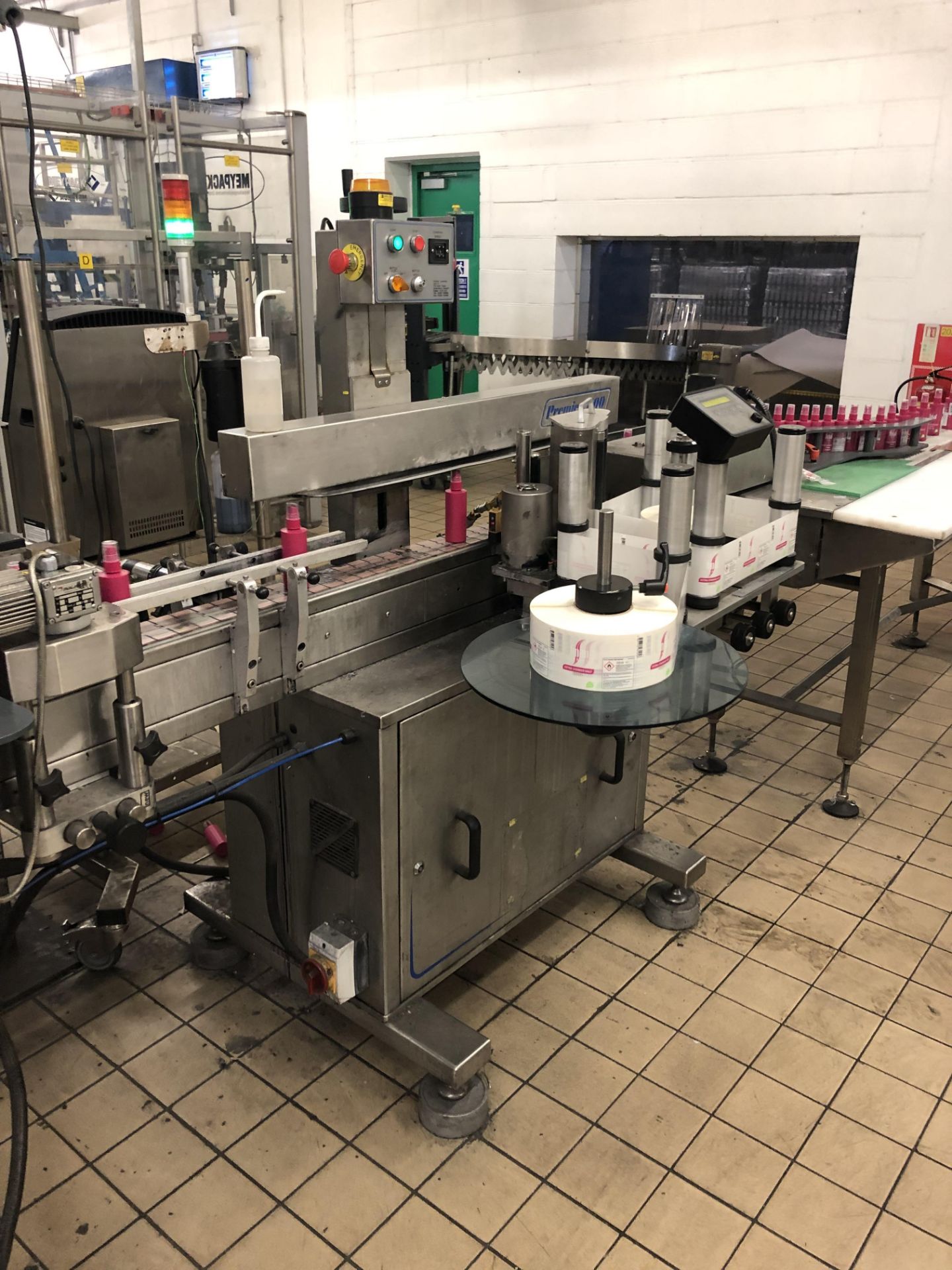 Premier 400 single sided wrap labeler with top hol