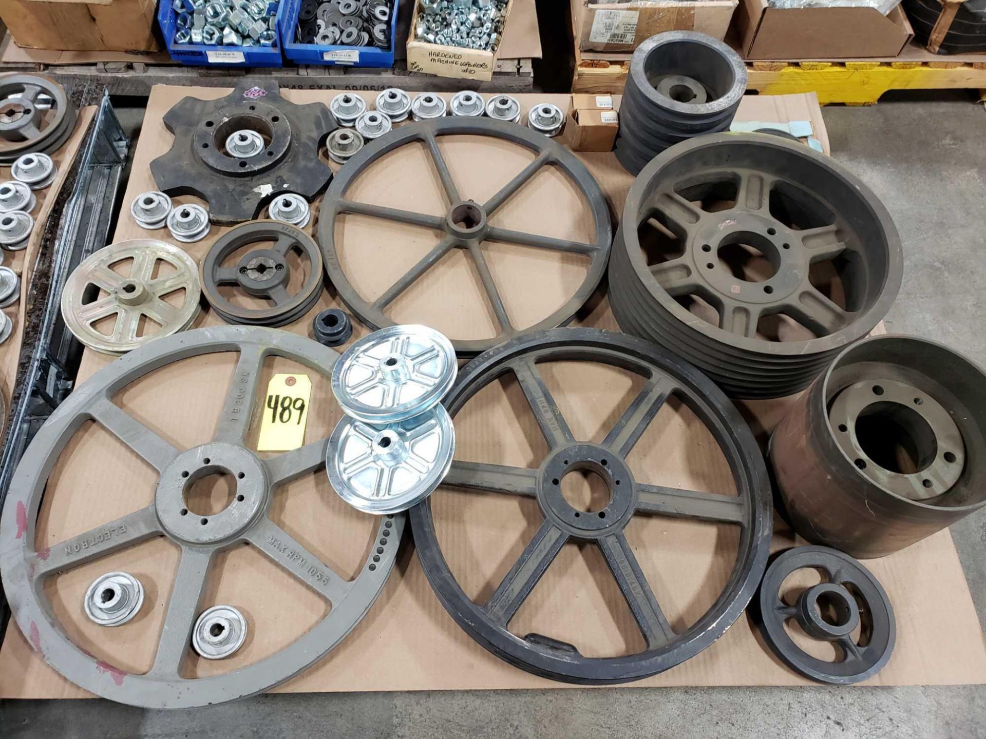 Pallet of assorted sprockets and gears.