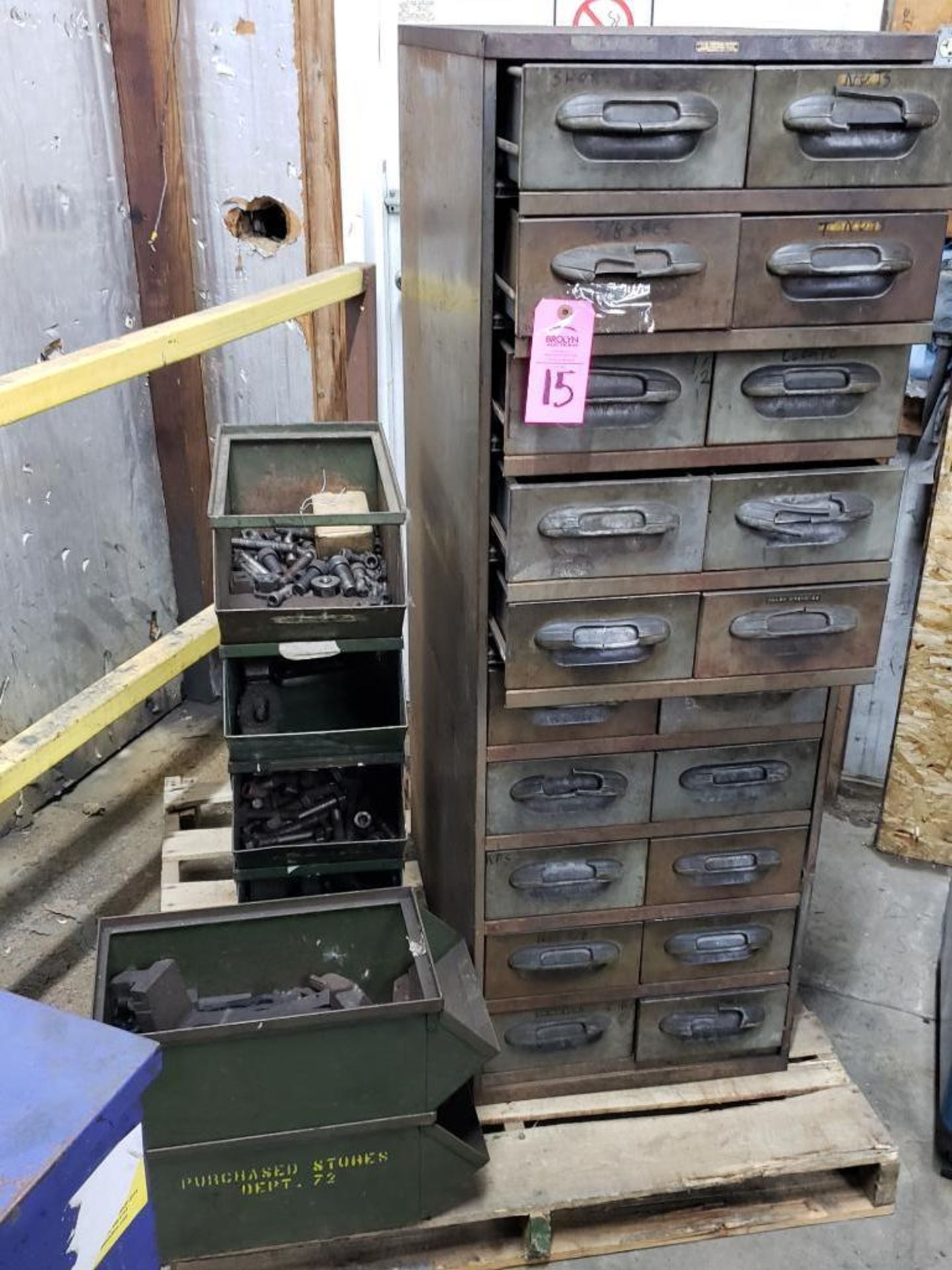 Storage bins and drawers with large quantity of press hold down hardware.