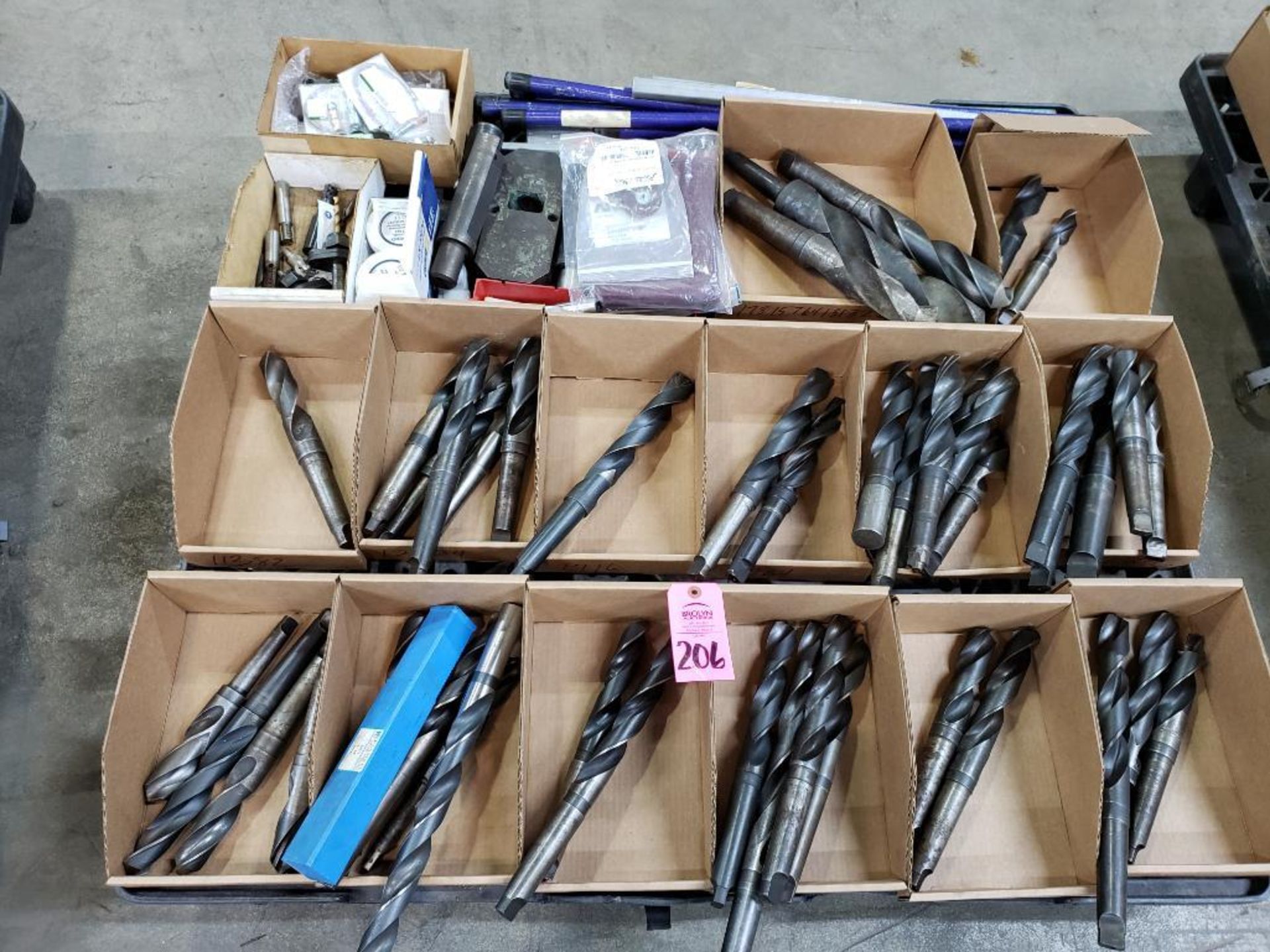 Pallet with large assortment of drills and other assorted consumables.