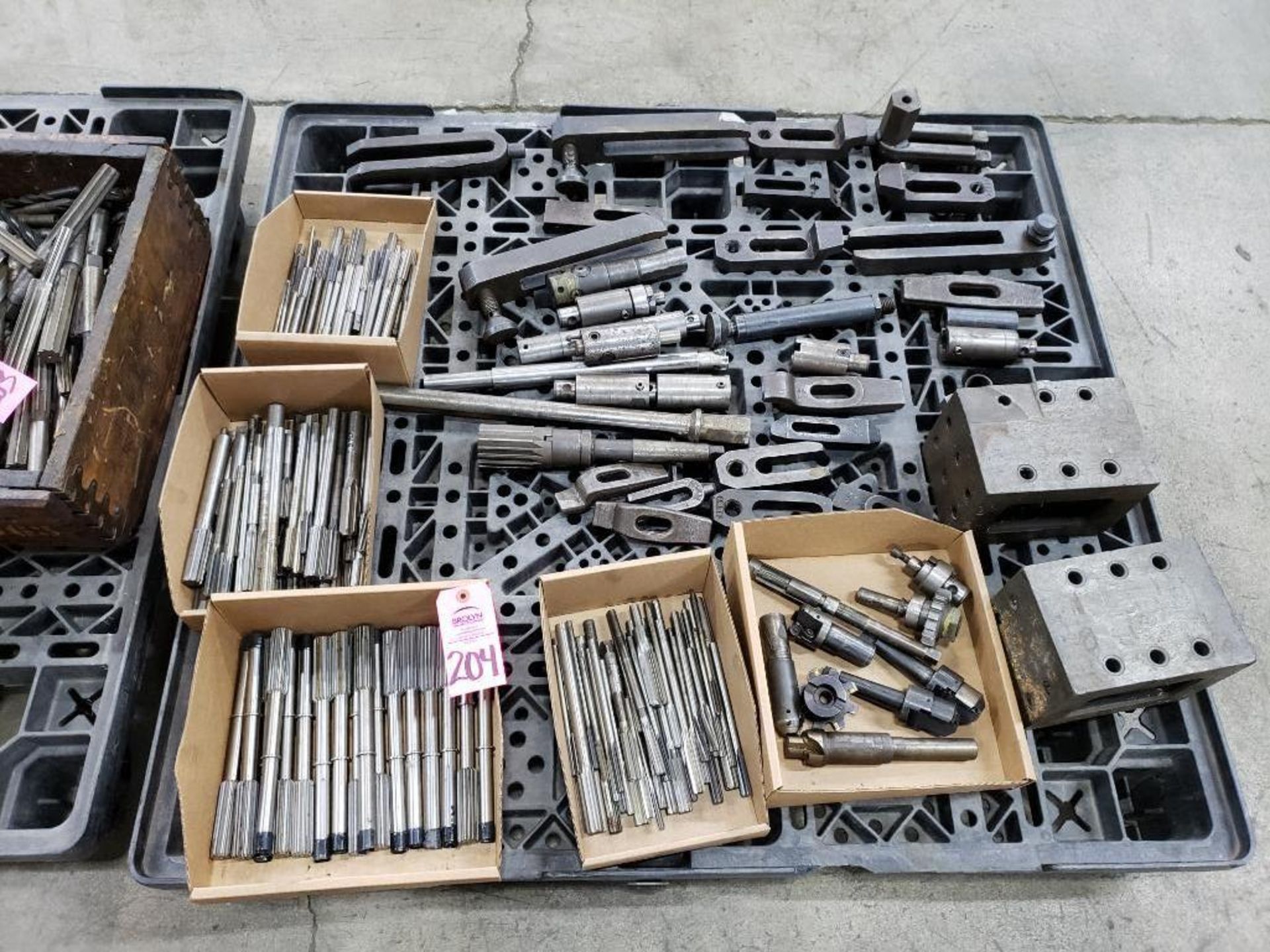 Pallet with large assortment of reamers, set up blocks, hold downs and other assorted fixtures.