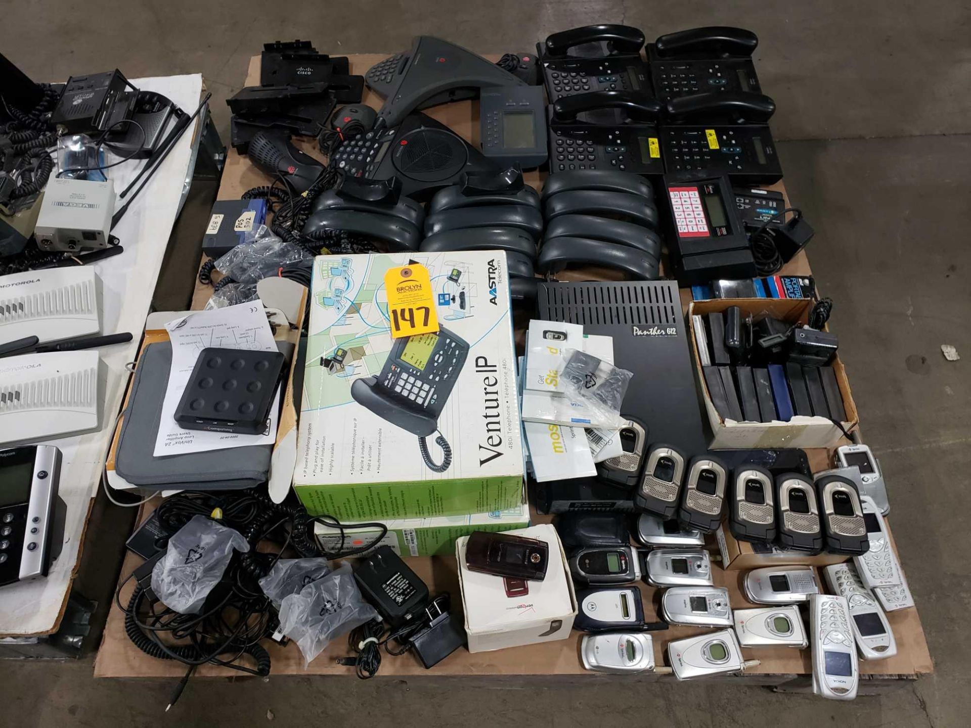 Pallet of assorted phones, polycom units, walkie talkies, cell phones, etc.