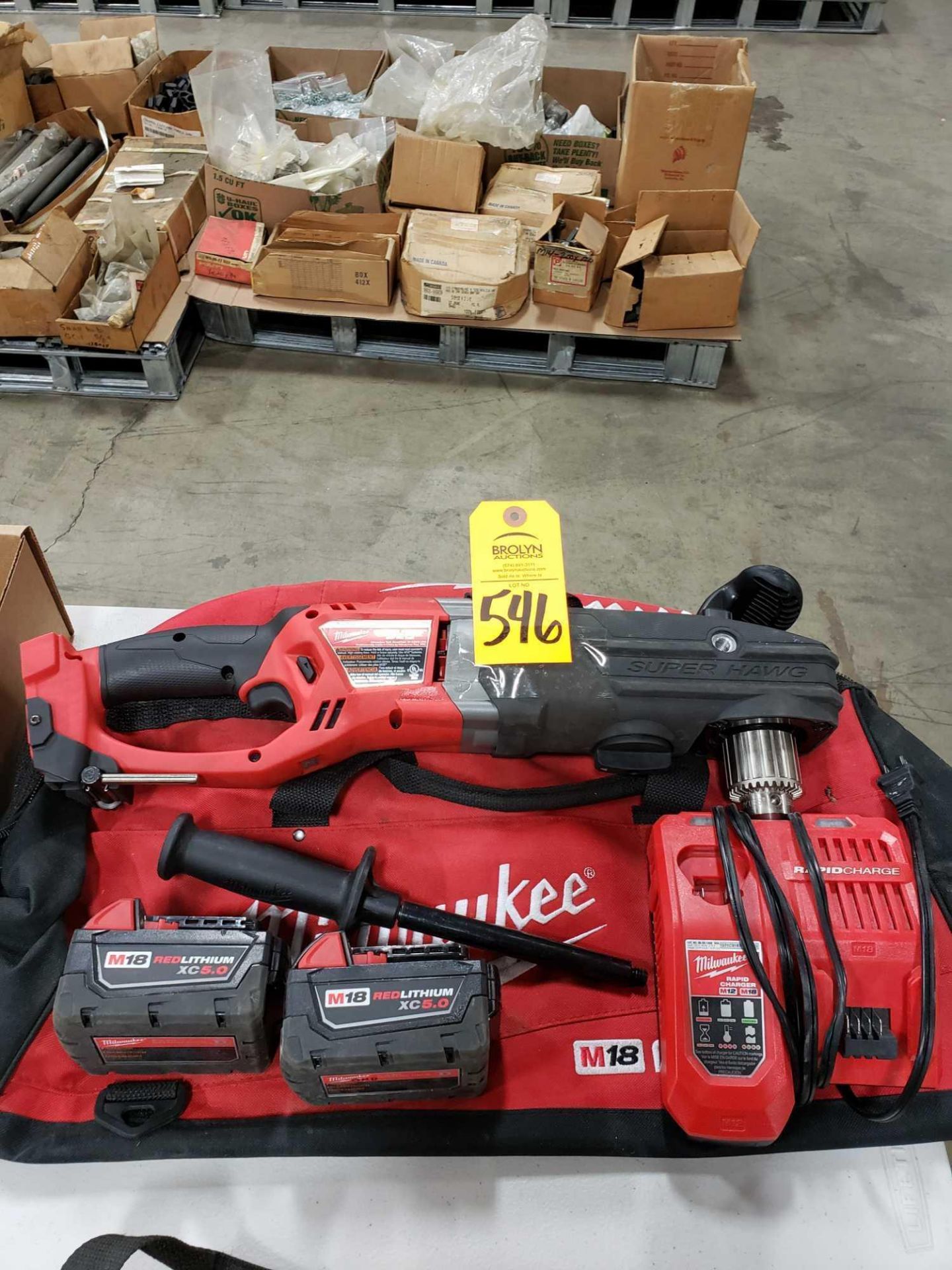 18v Milwaukee 1/2" super hawg right angle cordless drill with 2 batteries, charger, and storage bag.