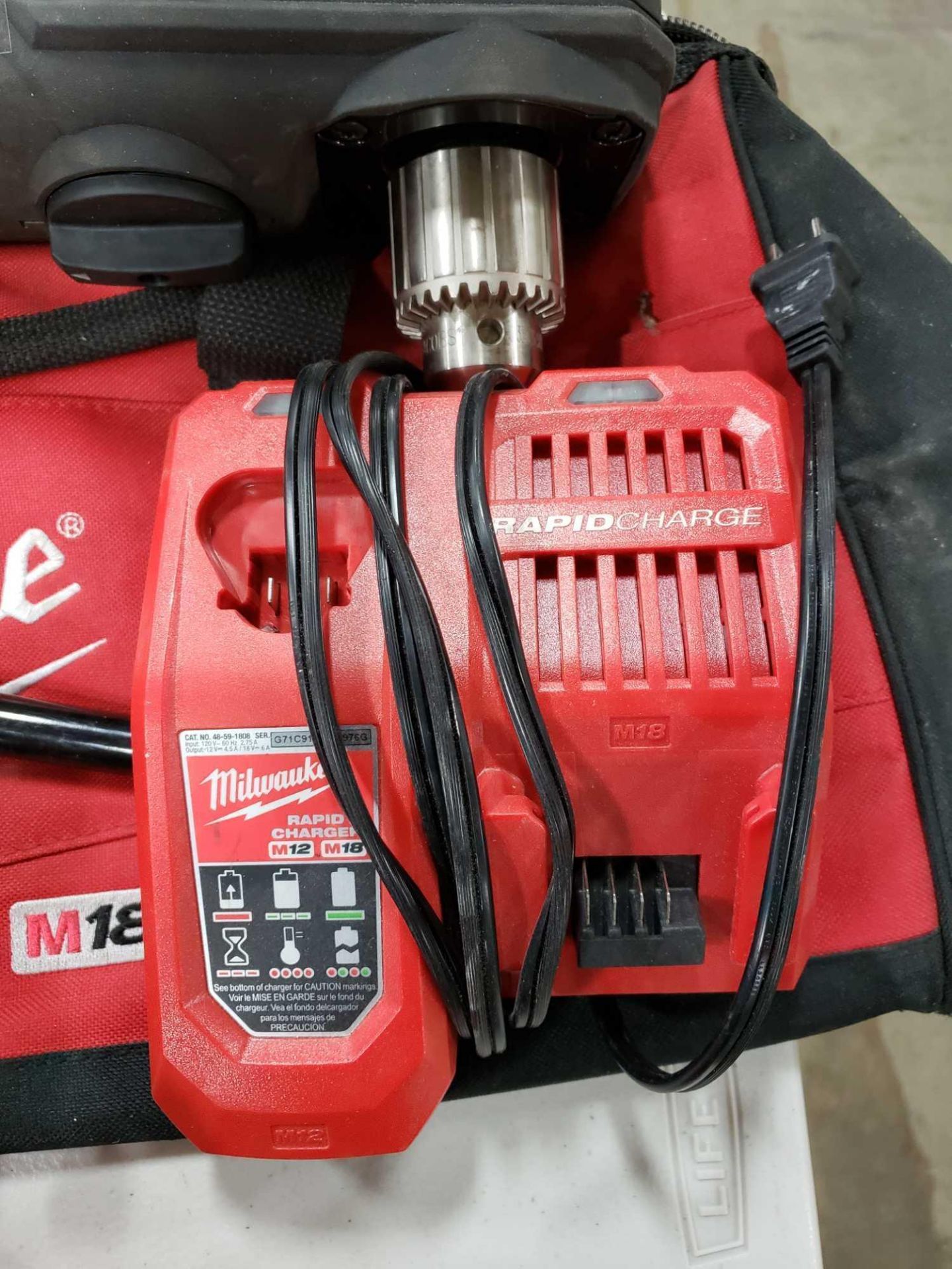 18v Milwaukee 1/2" super hawg right angle cordless drill with 2 batteries, charger, and storage bag. - Image 4 of 4