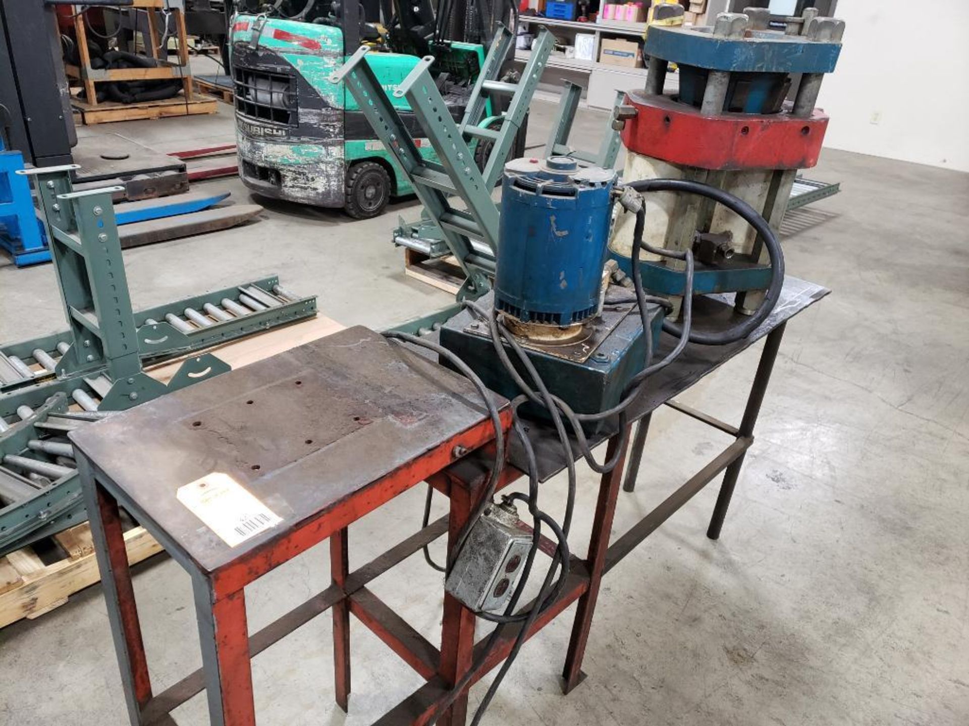 Hydraulic crimper station with hydraulic power pack. Includes steel table.
