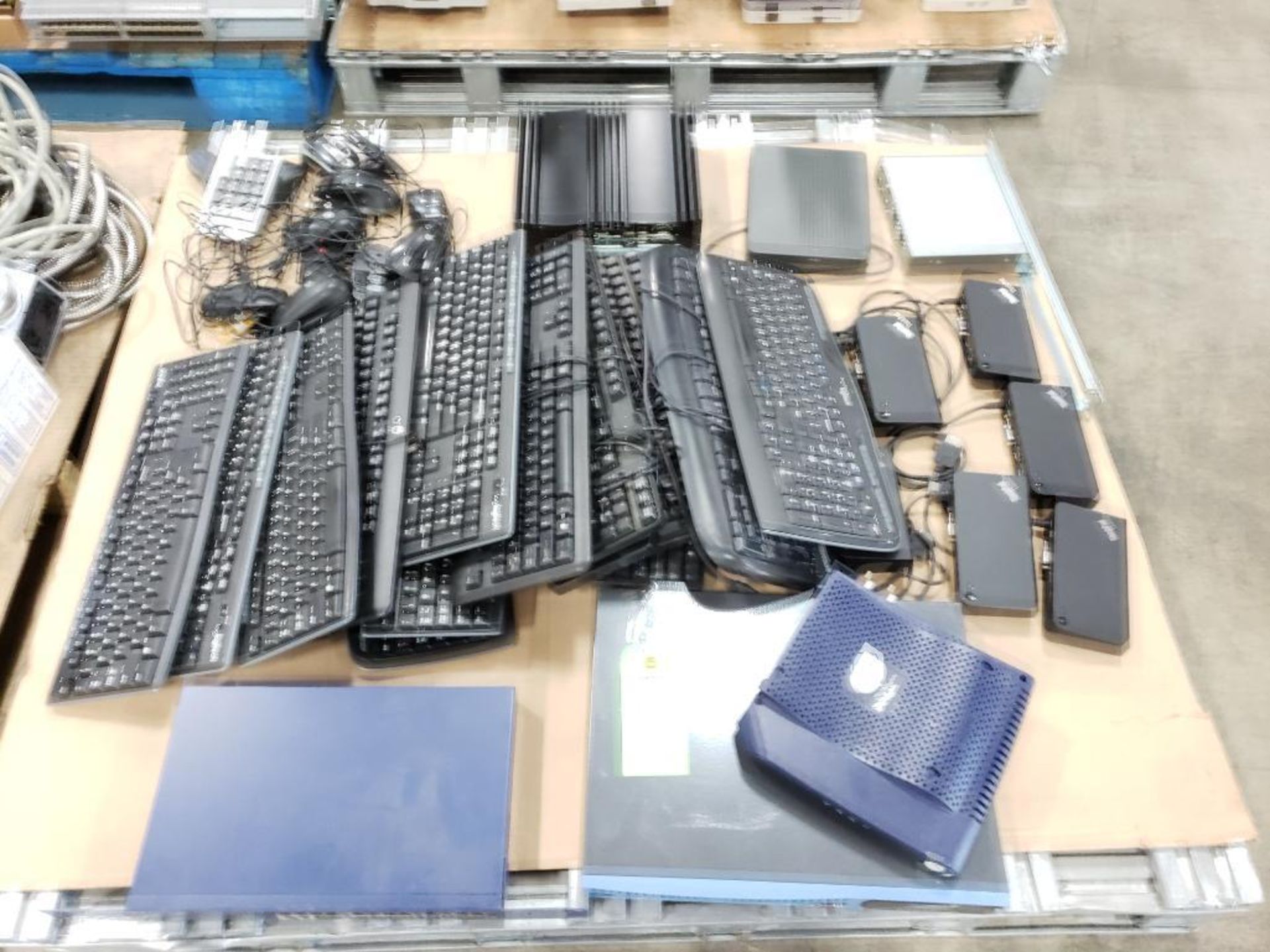 Pallet of assorted computer parts and equipment.