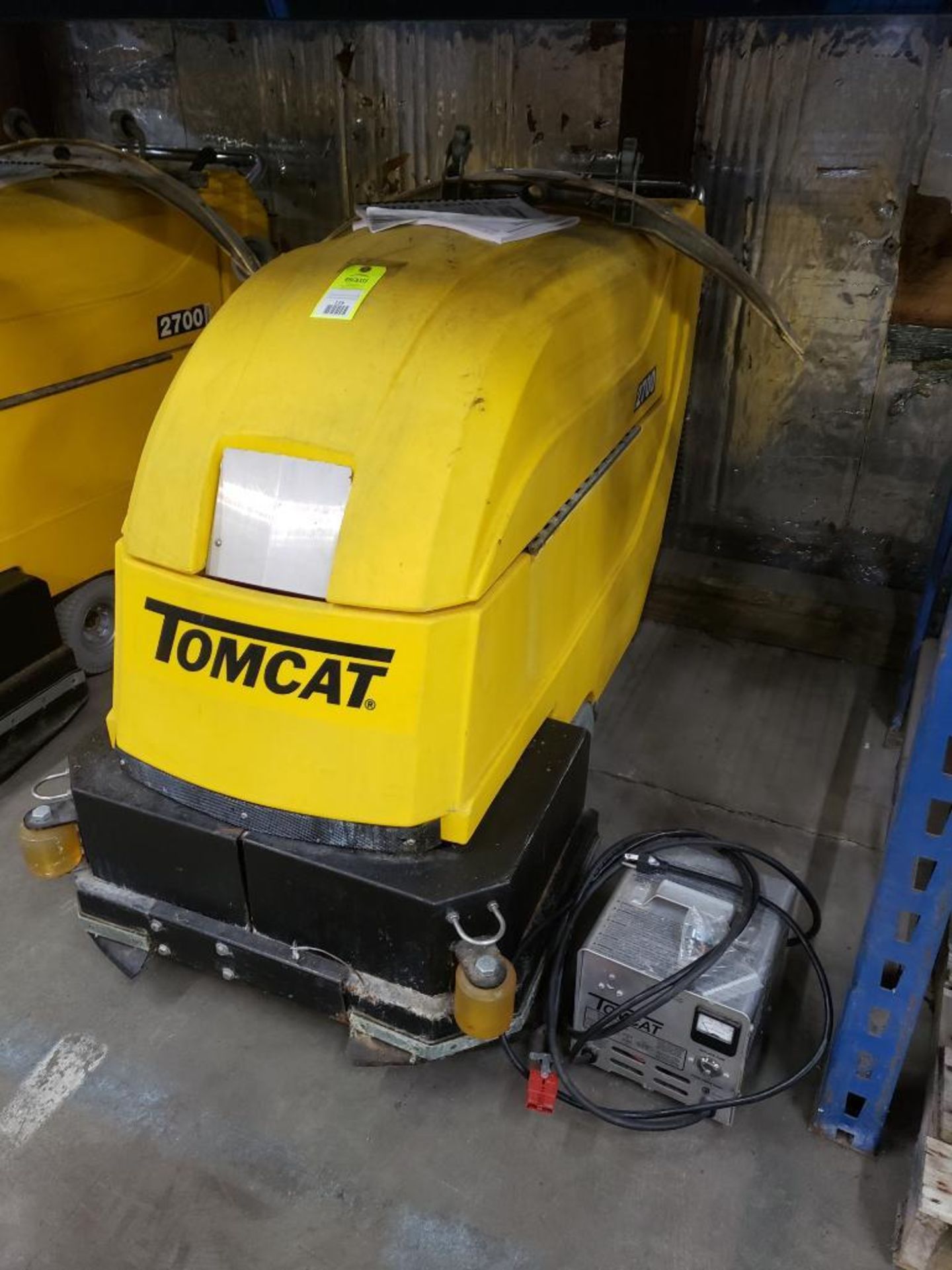 Tomcat 2700 industrial floor scrubber includes charger.