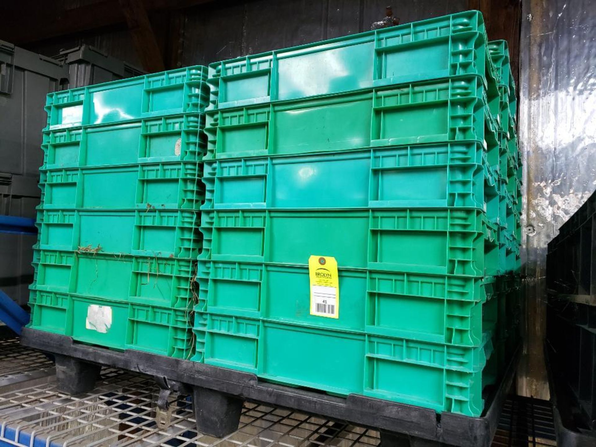 Pallet of plastic totes.