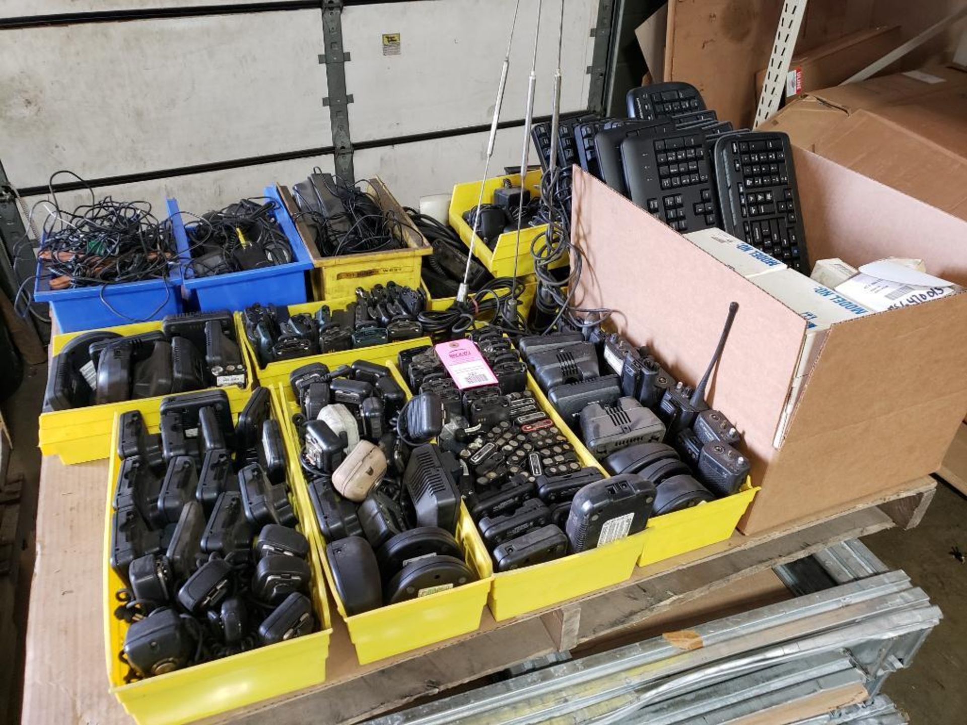 Pallet of assorted walkie talkies accessories, computer hardware etc.