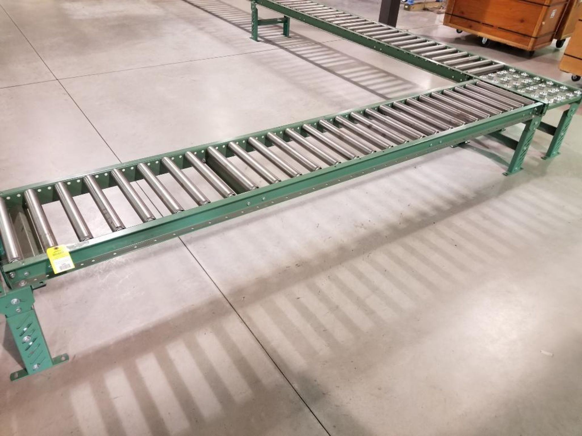 10ft roller conveyor section. 20in wide by 20in tall. (legs are adjustable to change height)