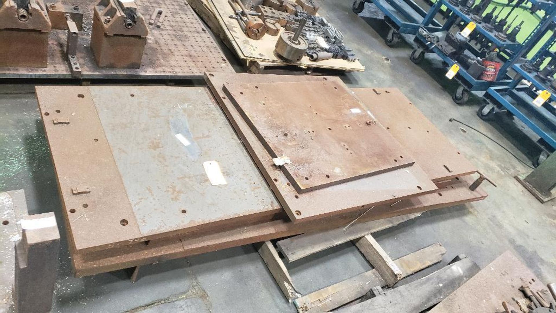 Assorted steel fixture plates.