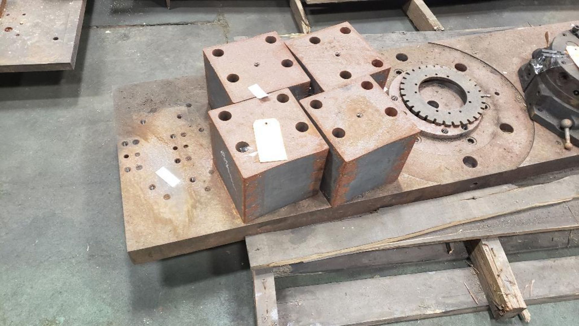 Steel fixture plate and riser blocks.