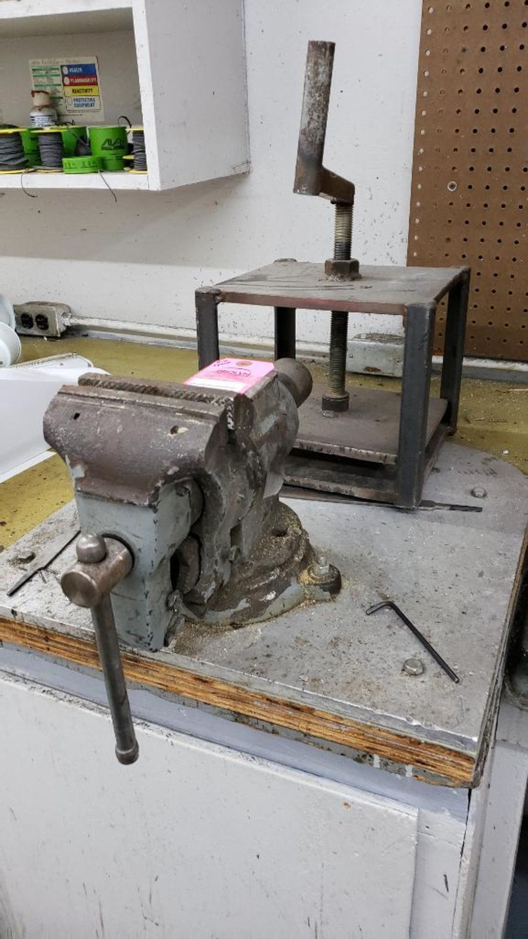 Bench vise and clamp press.