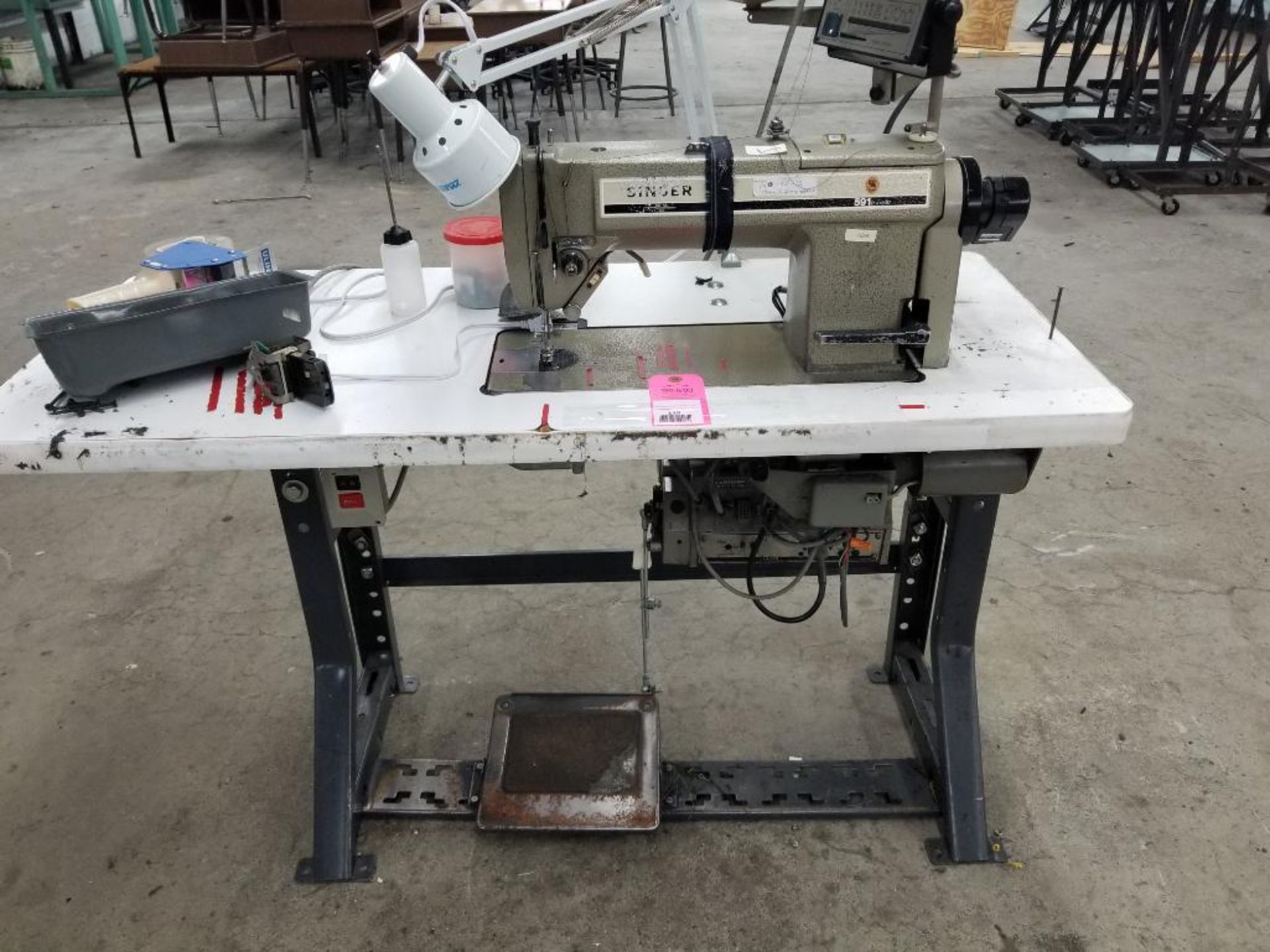 Singer single needle industrial sewing machine. Model 591. Serial #U921310412. 3 phase, 220-240v.