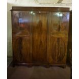 Mahogany Triple Door Wardrobe, Enclosing a hanging rail, fitted shelves and drawers, 207cm high,