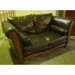 Brown Leather Two Seater Sofa, with two rolled cushions, 87cm high, approx 180cm wide, approx