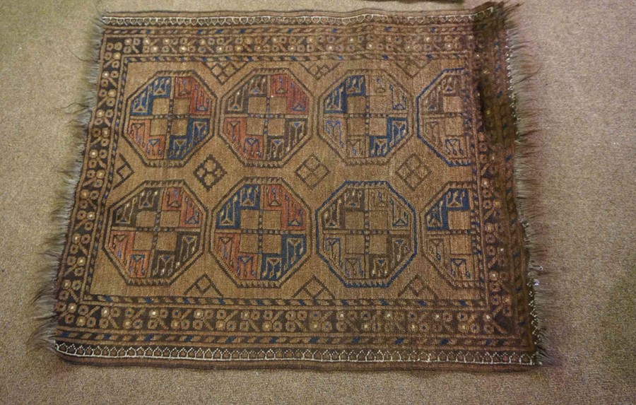 Persian Bluch Rug, Decorated with eight geometric medallions on a brown ground, 119cm x 94cm