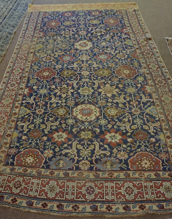 Shirvan Kuba Rug (Caucasian) Decorated with allover floral and geometric motifs on a red and blue