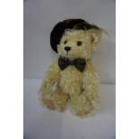 Modern Steiff Teddy Bear, Having button and label to left ear, wearing a tartan bonnet and bow