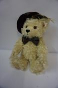 Modern Steiff Teddy Bear, Having button and label to left ear, wearing a tartan bonnet and bow