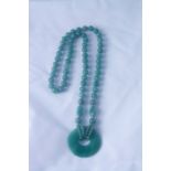 Spinach Jade Bead Necklace, with a fixed jade circular pendant, approximately 36cm long, (2)