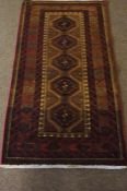 Bluch Prayer Mat / Rug, Decorated with five geometric medallions on a red ground, 122cm x 66cm