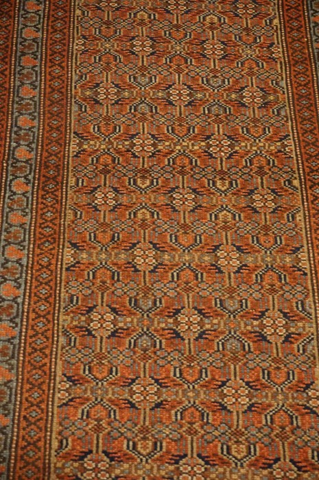 North West Persian Runner, Decorated with allover floral panels on a red and blue ground, with beige - Image 2 of 4