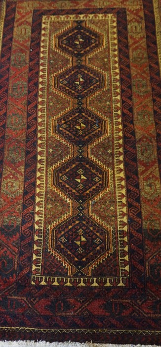 Bluch Prayer Mat / Rug, Decorated with five geometric medallions on a red ground, 122cm x 66cm - Image 2 of 3