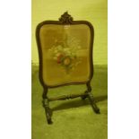 Victorian Rosewood Firescreen, Having a needlepoint floral panel on silk to the front, beneath