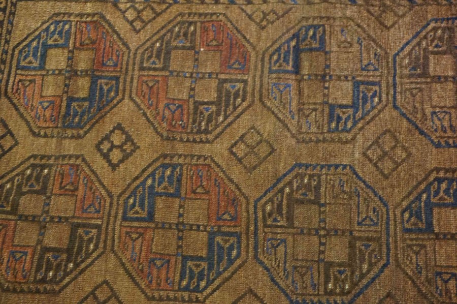 Persian Bluch Rug, Decorated with eight geometric medallions on a brown ground, 119cm x 94cm - Image 2 of 4