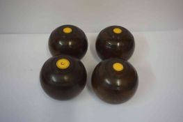 Set of Four Lignum Vitae Bowling Balls, Stamped for Taylor Rolph & Co, having ivory mounts, (4)
