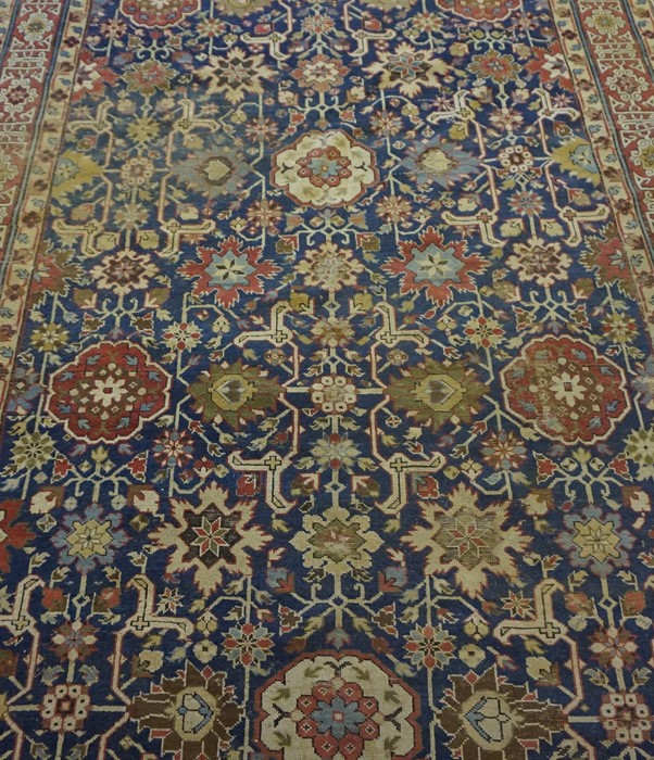 Shirvan Kuba Rug (Caucasian) Decorated with allover floral and geometric motifs on a red and blue - Image 2 of 7